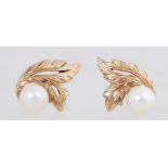 A pair of 9ct gold earrings set with pea