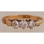 A 9ct gold CZ trilogy ring. Hallmarked B