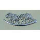 A vintage staybright elephants brooch, in silver tone metal with a loop clasp. Measuring 5.