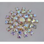 A large 1950s aurora rhinestone brooch in a gold tone metal setting with a roll over clasp,