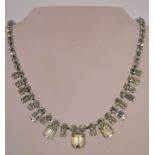 A 1950s rhinestone necklace in a silver tone metal setting with a bolt ring clasp, measuring at 40.