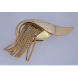 A large 1980's fringed brooch in a gold tone metal being 8cms long, 5.