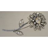 A large 1960s rhinestone brooch in a silver tone setting with a roll over clasp,