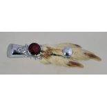 A vintage taxidermy grouse foot brooch by Mizpah,