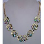 A 1970s rhinestone necklace in gold tone metal with a box clasp, measuring 41cms long.