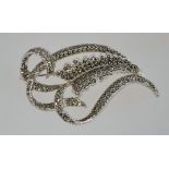 A large 1950s marcasite brooch in silver tone metal with a "HOLLYWOOD" mark and a roll over clasp,