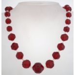 A 1920s to 1930s art deco red and pink glass bead necklace,