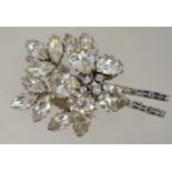 A very large 1950s rhinestone brooch in silver tone metal with a loop clasp and safety chain,