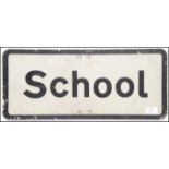 A vintage 1970's road sign ' School ' on metal with painted frontage having central notation.