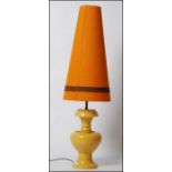 A retro 1970's large Royal Doulton mustard coloured oversized table lamp complete with conical