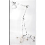 A freestanding Herbert Terry Industrial 1970's floor standing anglepoise lamp on trolley.