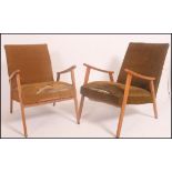 A pair of 1950's mid century Danish armchairs having angular frames with shaped elbow supports with