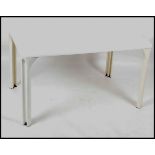 A 1970's retro Italian dining table in white by Vico Magistretti.