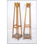 A good pair of mid century oak tapering Industrial office - school staff room hat - coat stands.