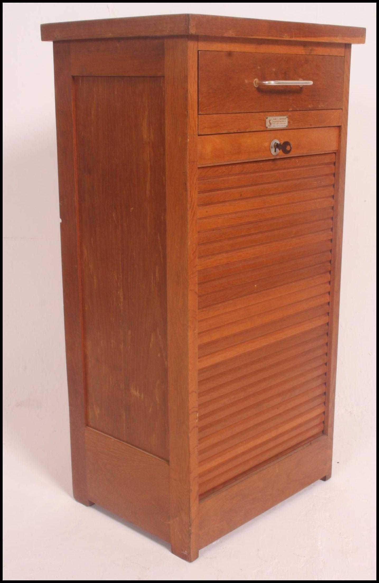 A 1940's /mid century oak Industrial office tambour filing cabinet system.