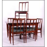 A 1960's G- Plan teak dining table and 6 chairs believed Danish designer IB Kofod Larsen.