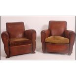 A good pair of 1930's Art Deco French leather club / chesterfield armchairs having barrel arms and
