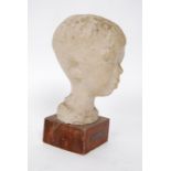 A plaster study sculpture of a boys head on socle plinth marked for Lorenze Pepe - Liloceramica .