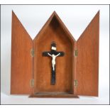 A 20th Century wooden crucifix cabinet c