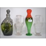 Pair of cut glass, handled decanters of