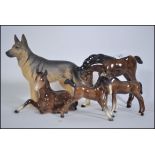 A collection of four Beswick horses and