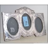A silver hallmarked Adams revival triptych - triple picture frame with wooden back and easel