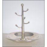 A silver hallmarked ring stand come pin dish with rubbed marks. Weight 34.9g. Measures 9cm high.