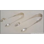 2 pairs of silver hallmarked sugar tongs,