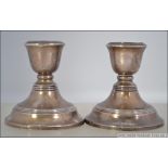 2 silver hallmarked stub candlesticks with ribbed decoration and single sconces to each.