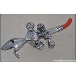 A continental silver 800 marked babies rattle having a coral adorned mouthpiece. Weight 47.