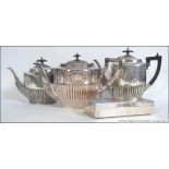 An Edwardian Walker & Hall silver plated coffee pot - teapot service together with hot water jug.