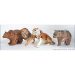 A collection of ceramics to include a Beswick prowling Lion, a USSR Tiger,