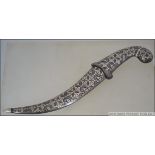 An arabic silver plated Persian dagger having geometric design complete with scabbard.