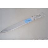 A large silver hallmarked paper knife with wheatsheaf handle having initials DP.