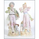 A Pair of Continental bisque figurines dating to the early 20th century.