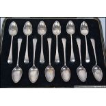 A cased set of 12 silver hallmarked spoons complete in the presentation box.