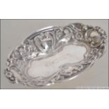 A small silver hallmarked pin tray of rococo form by Broadway and Co bearing hallmarks for