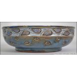 A Royal Doulton stoneware Art Nouveau fruit bowl of drip glaze form,