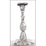 A silver 20th century continental candlestick having single sconce, the base marked for 830S .