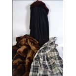 A group of three vintage and retro ladies coats to include two simulated furs and a woolen coat.