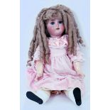 ANTIQUE DOLL: A good late 19th / early 20th century German made bisque headed antique doll.