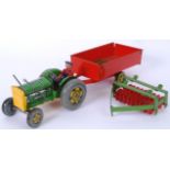 METTOY: A charming vintage Mettoy tinplate clockwork tractor, trailer and plough. Working order.