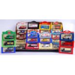 LLEDO: A collection of 32x Lledo promotional diecast models - Rowntrees, Coca Cola, Rupert The Bear.