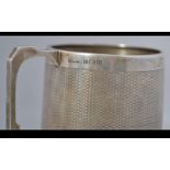 A silver hallmarked engine turned decorated Christening mug with Birmingham assay stamp,