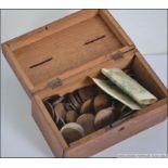 A small collection of late 19th century and later coins and notes all contained within a vintage