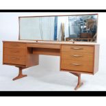 A mid 20th century teak Austinsuite low and long dressing table fitted with an central drawer with