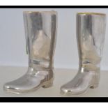 A pair of 20th century silver plated boot measures - liquer measures with plastic inserts.