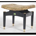 A mid century G-Plan upholstered dressing table stool raised on tapered supports with overstuffed