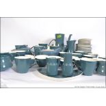 An extensive Poole pottery with a greyish blue finish consisting of coffee pots, tea pots,