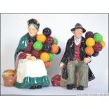 Two Royal Doulton figures, The Balloon Man HN 1954, The Old Balloon Seller HN 1315.